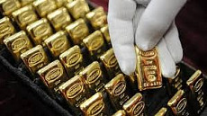 Золотые мерные слитки Нацбанка продолжают дорожать